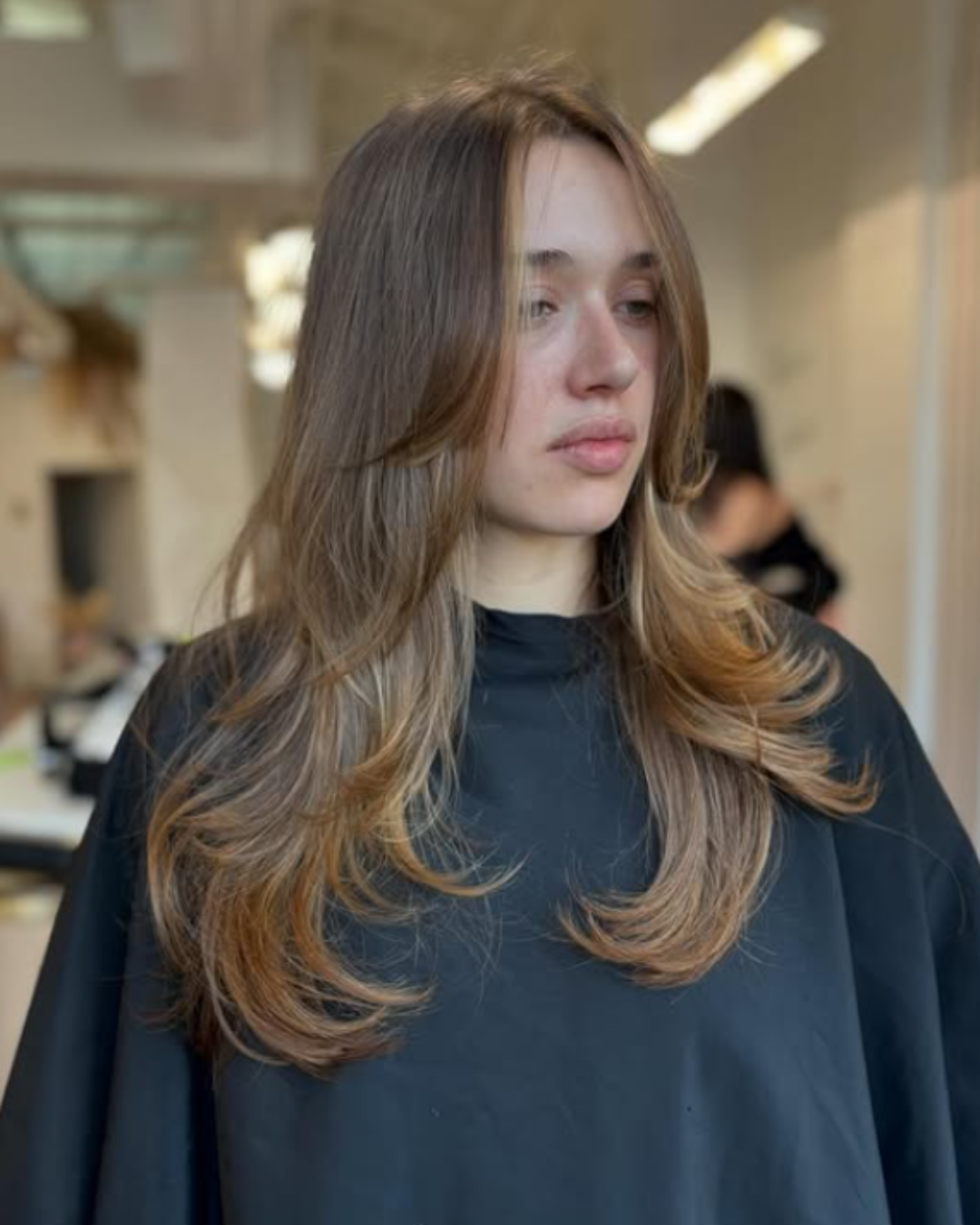 Long Layered Cut and Soft Golden Tone by Gel